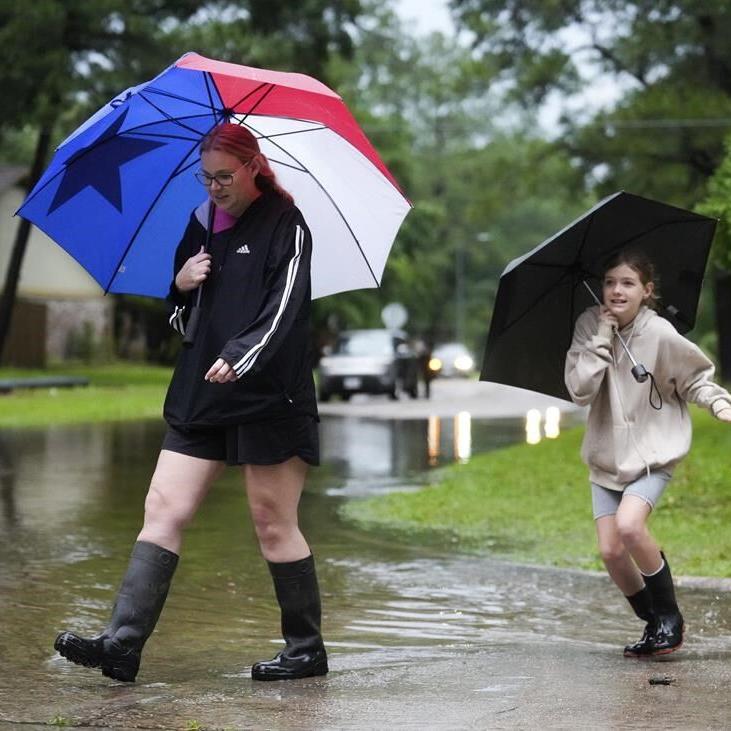 Heavy rains near Houston close schools and flood roadways as officials urge residents to evacuate